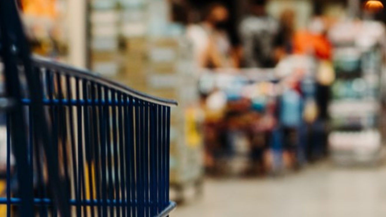 Image of a blue shopping cart with blurred out background