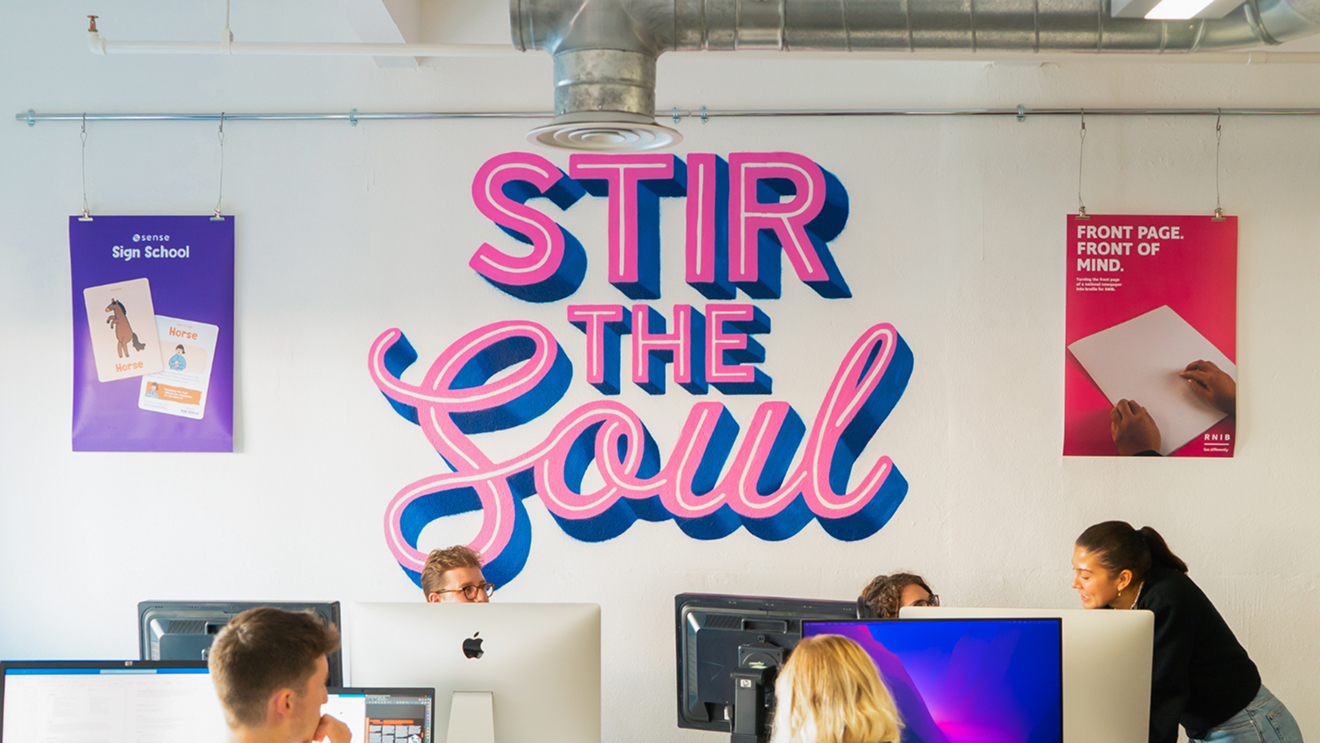 Image of 'Stir the Soul' painted in pink and blue on the wall
