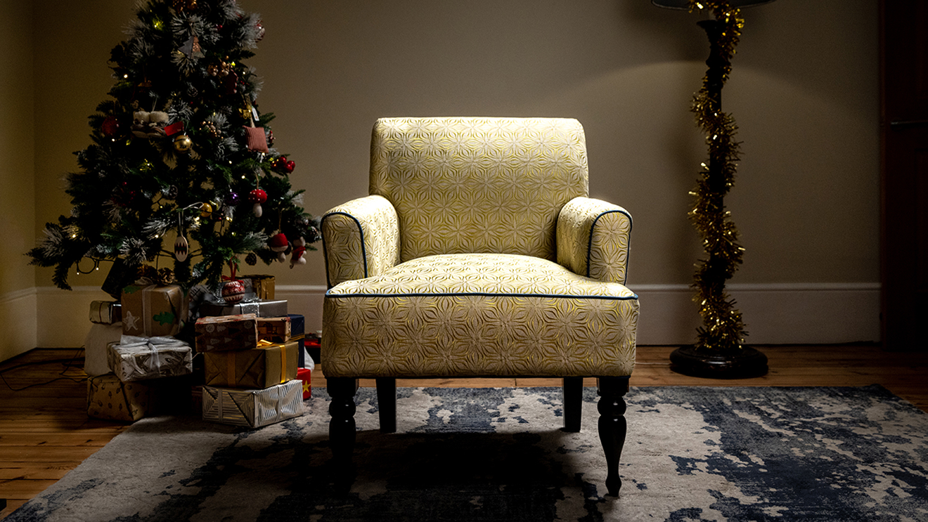 Christmas scene of a tree and an empty chair, for Sue Ryder's ‘The Empty Chair’ Campaign