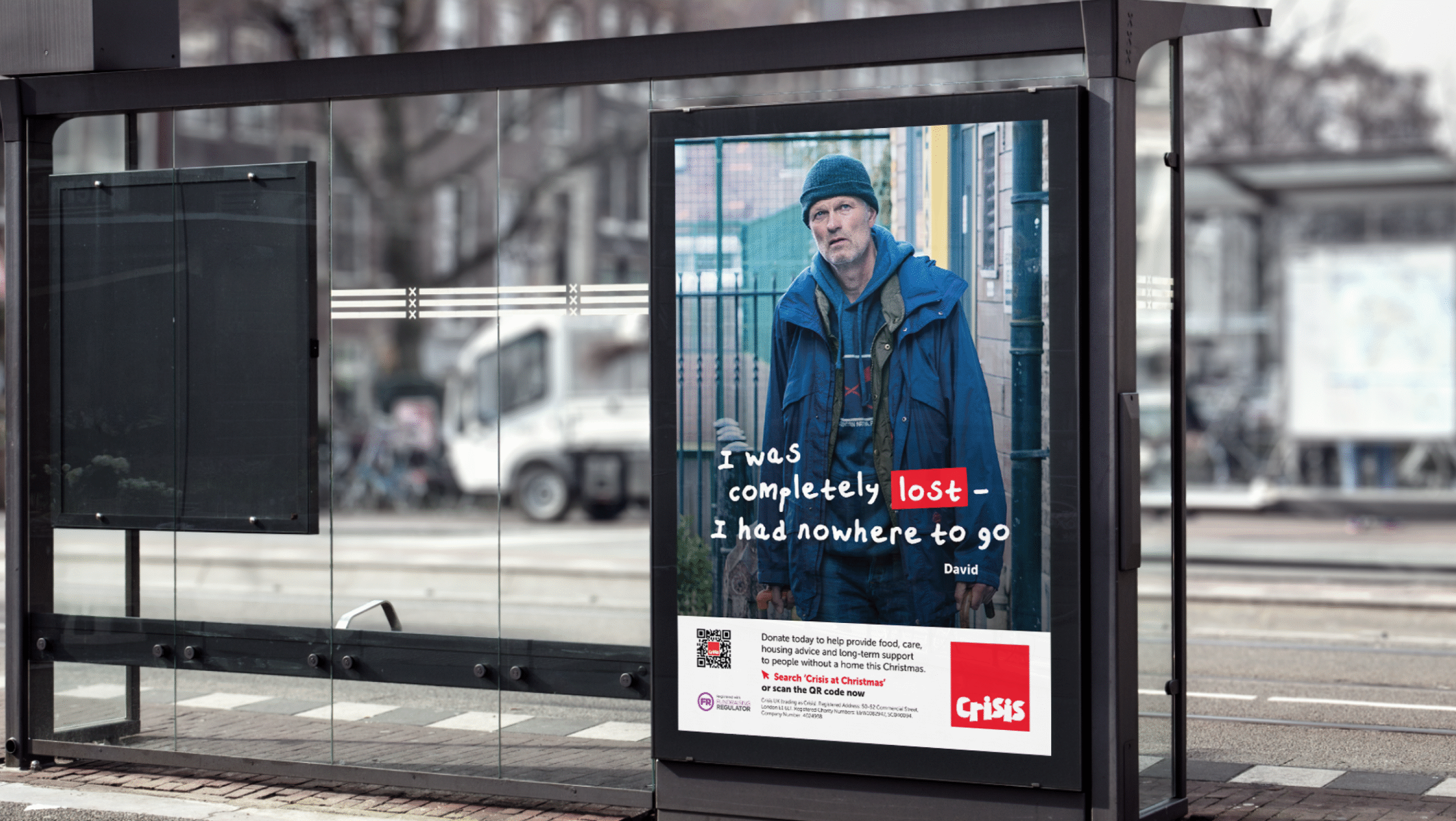 A photo of a bus stop with a poster of David and his quote in his handwritten font