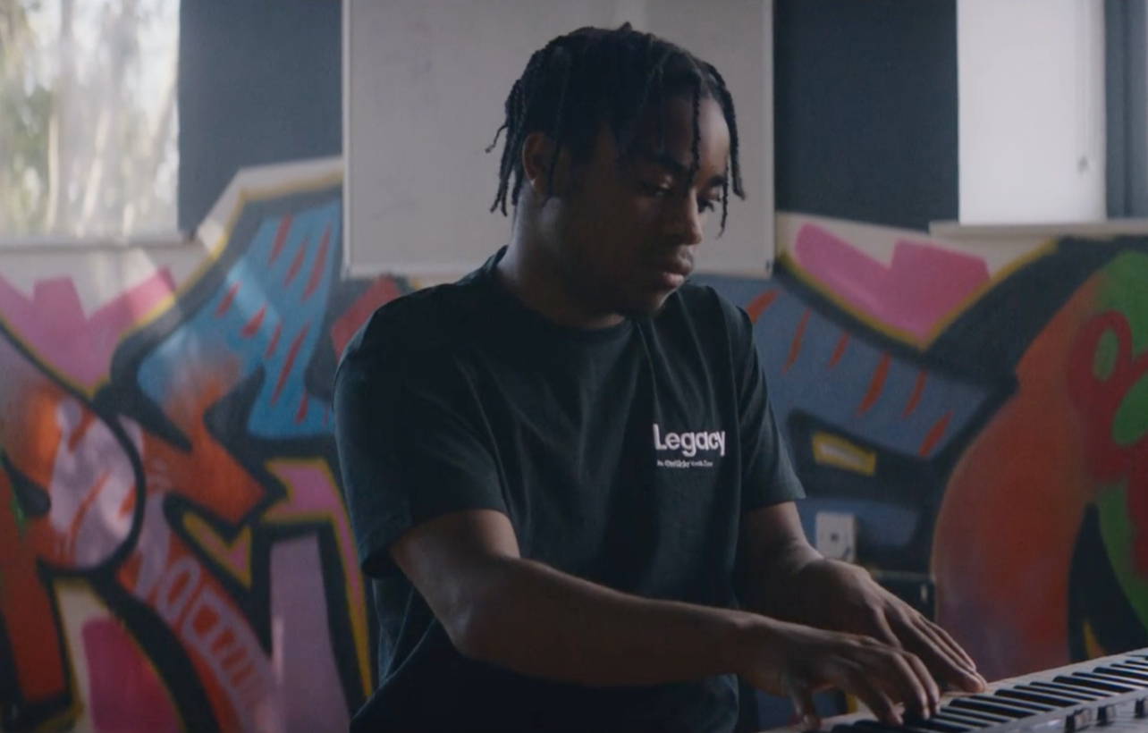 A young man plays the piano